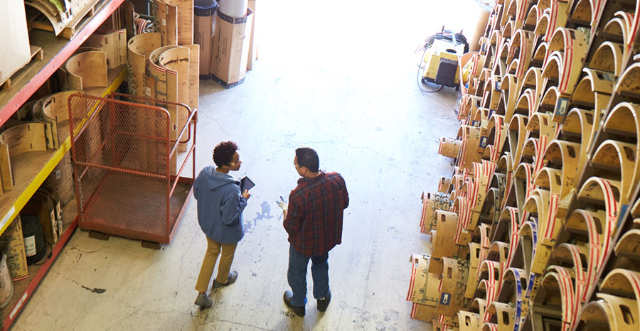 Two men at a warehouse